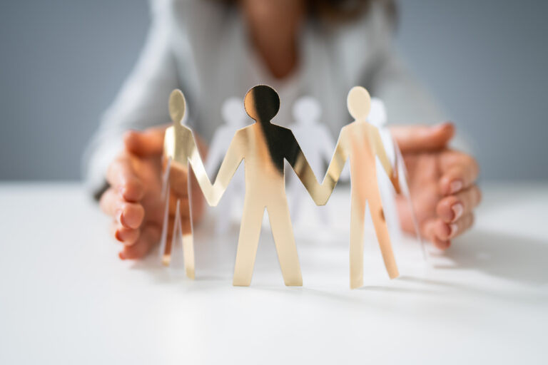 Person Protecting Paper Cut Out Figure